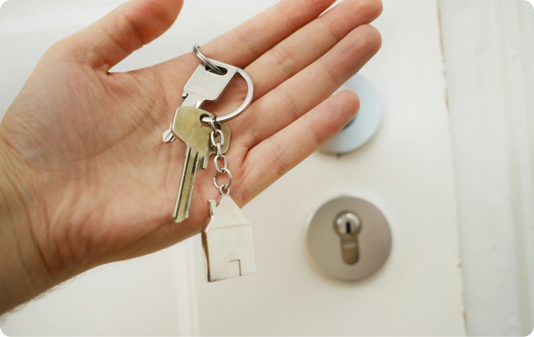 Hand holding the keys to a new home